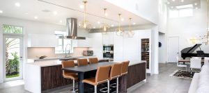Biophilic kitchen design by Sarah Z Designs in Miami — open-pore millwork, concealed induction, integrated circadian lighting and hidden scullery for a calm luxury space.