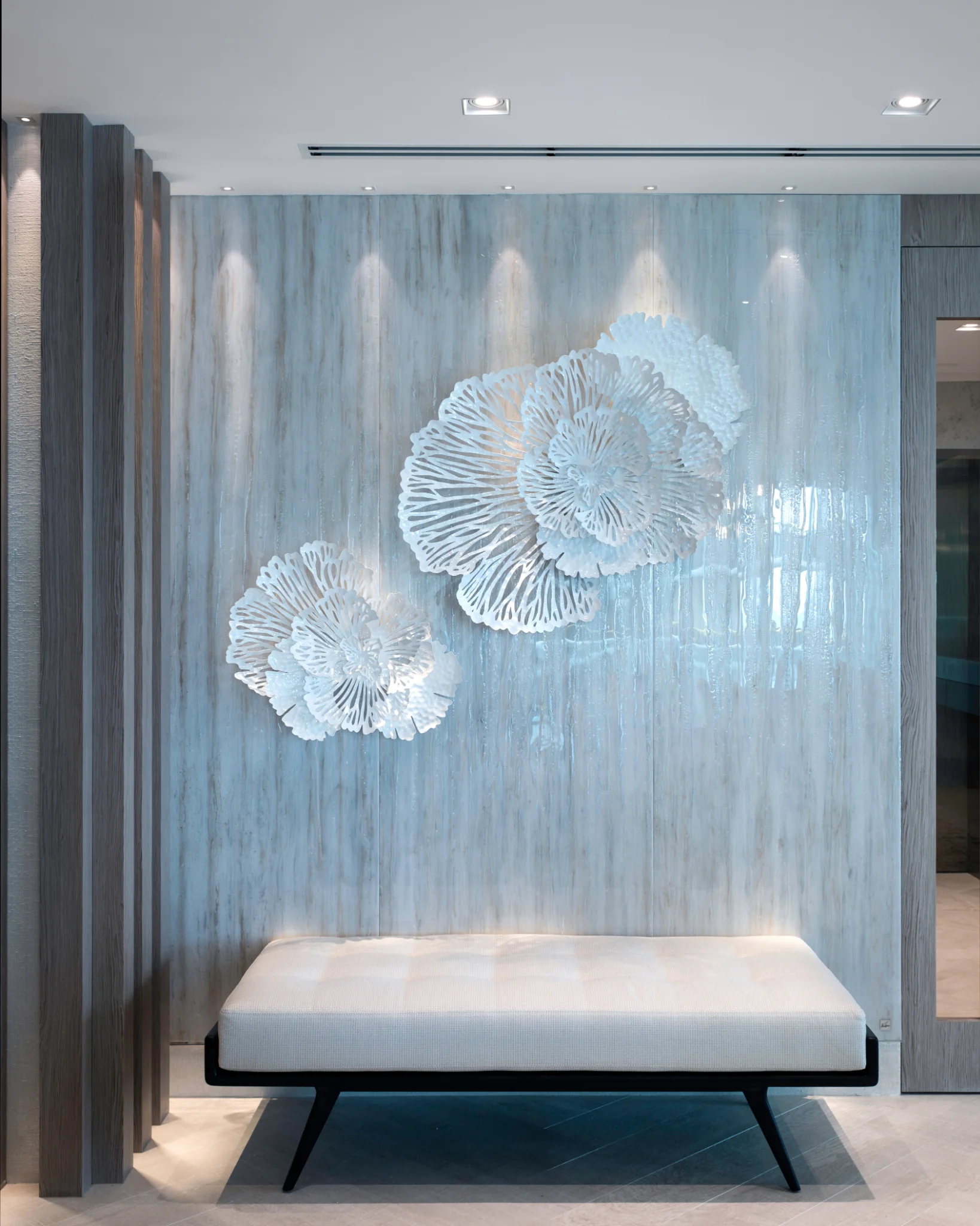 Restrained luxury palette in a Sunny Isles oceanfront residence by Sarah Z Designs, where sculptural detail, layered light and natural texture deliver quiet sophistication.