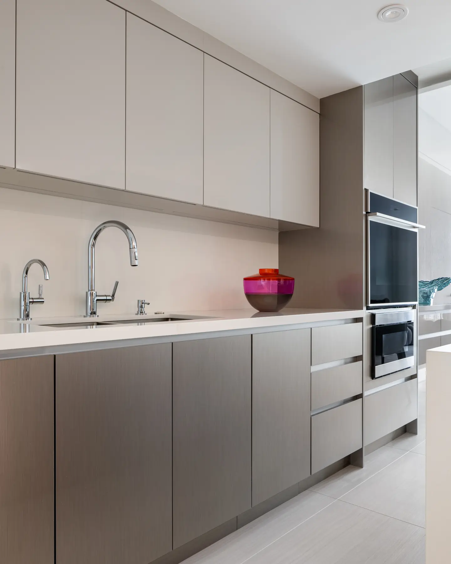 Matte brushed surfaces let light settle rather than bounce — a signature Organic Modern kitchen detail in a Pinecrest estate.