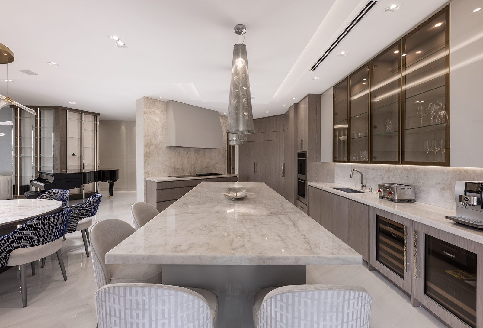 A quartzite island and warm wood cabinetry put natural materials where hands land every day.
